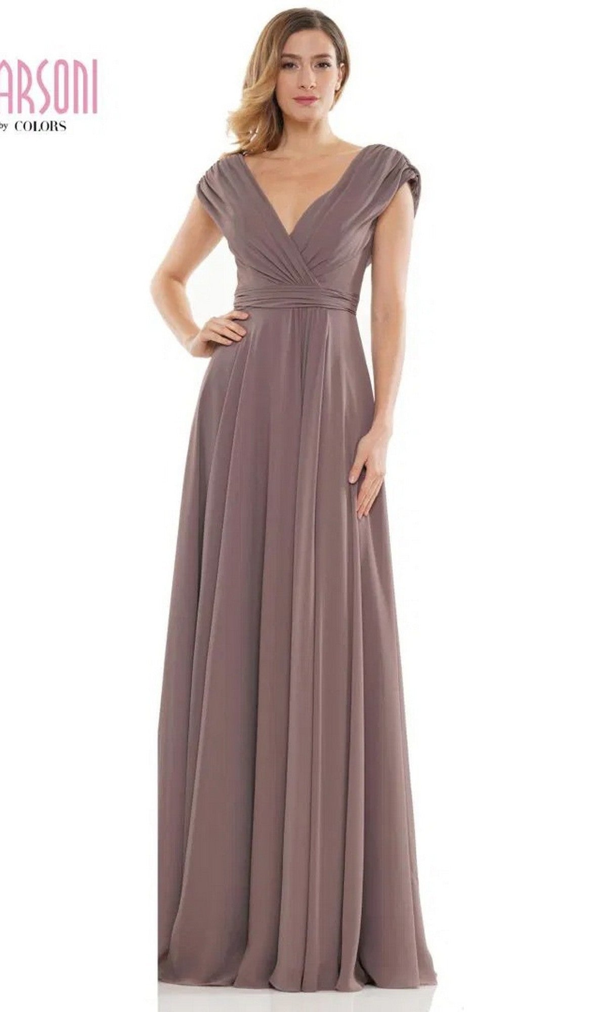 A woman wears the Marsoni M251, a floor-length mauve chiffon formal dress featuring cap sleeves, a deep V-neckline, and gathered waist detailing.